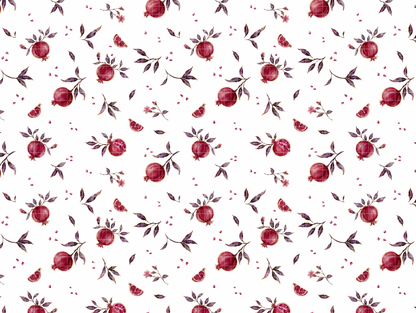 Seamless watercolor pattern design showing deep red pomegranates, sliced fruit, and green branches on a white background.