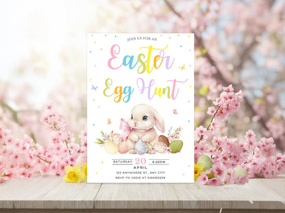  Pastel Easter Egg Hunt invitation with a watercolor bunny, colorful eggs, and confetti on a light background.