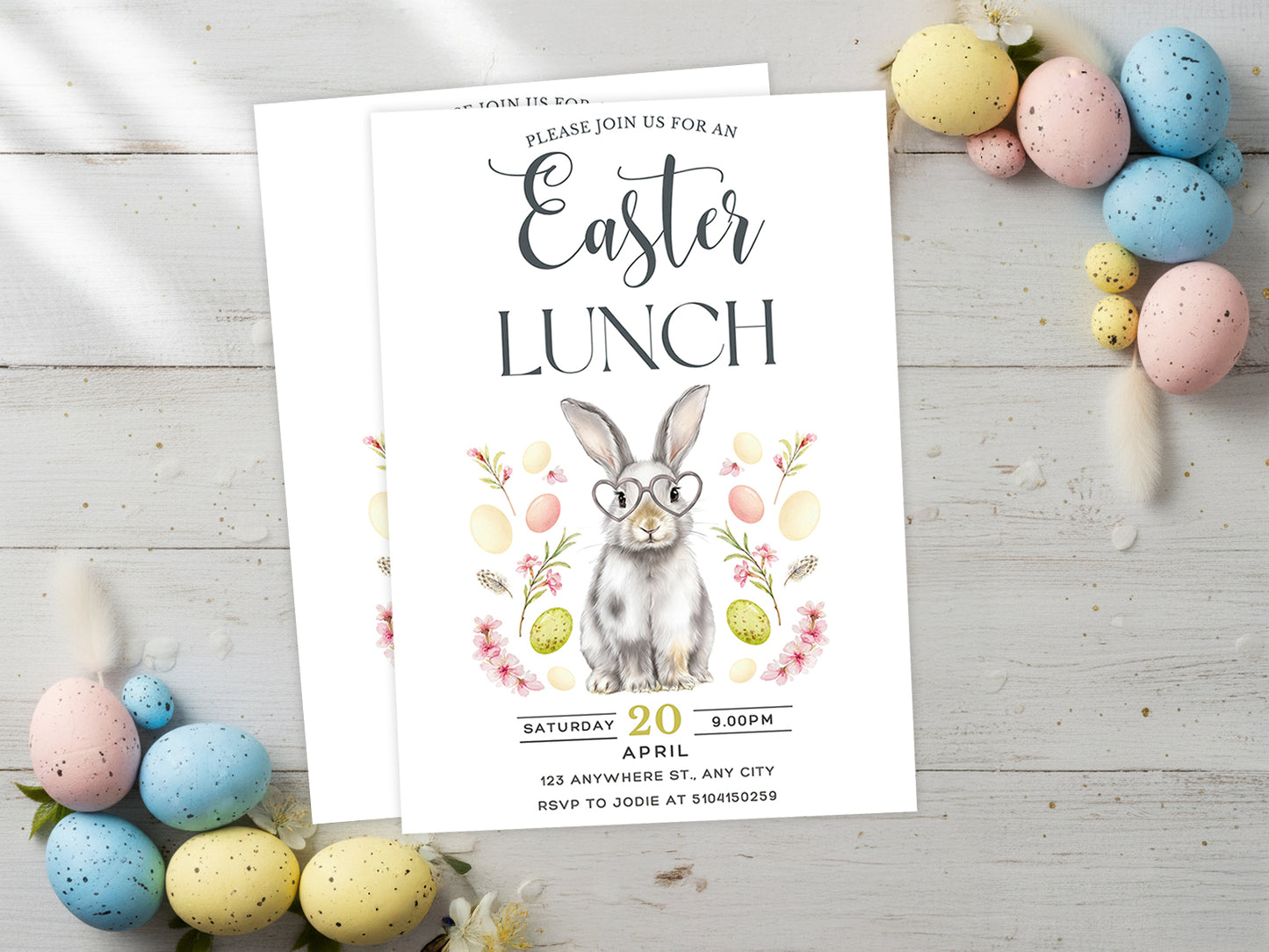 Elegant Easter Lunch invitation featuring a watercolor bunny wearing heart-shaped glasses, surrounded by spring flowers and pastel eggs.