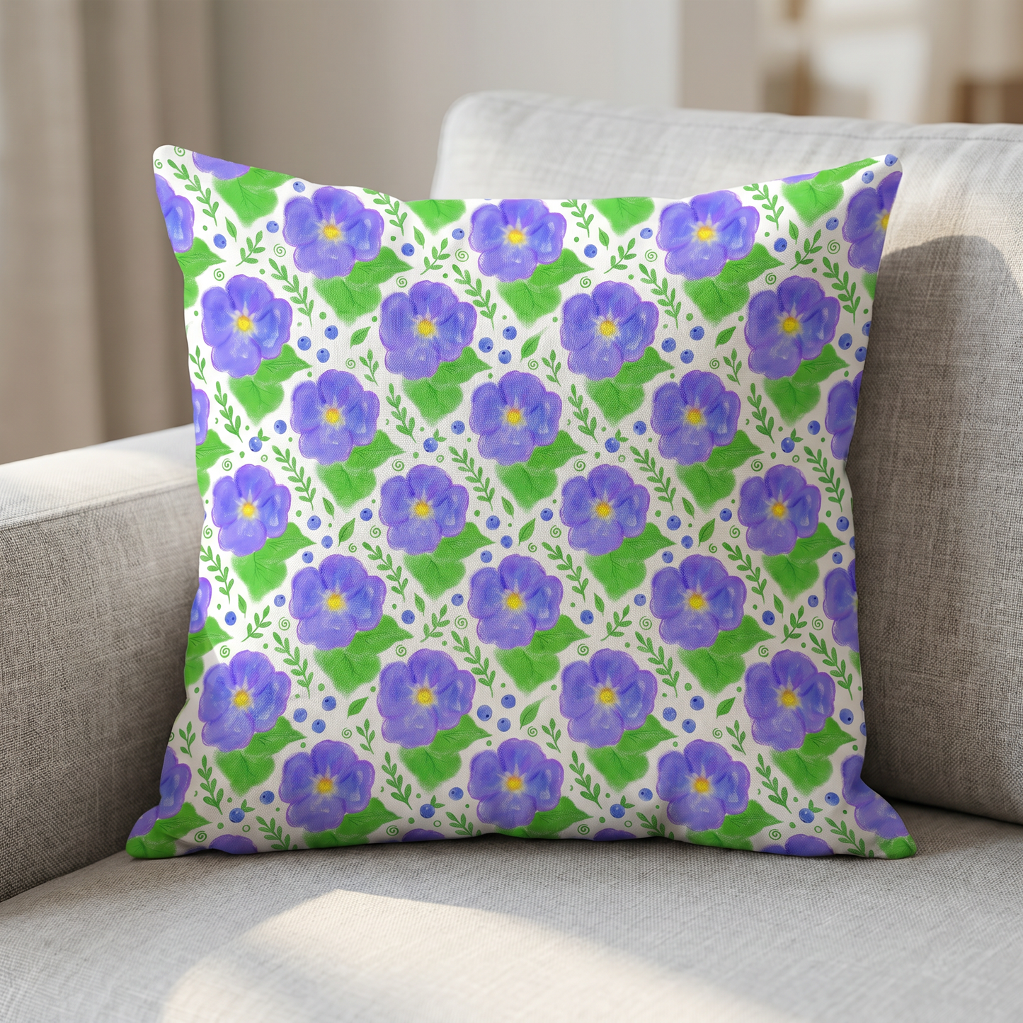 Throw pillow featuring a purple and green watercolor floral pattern.
