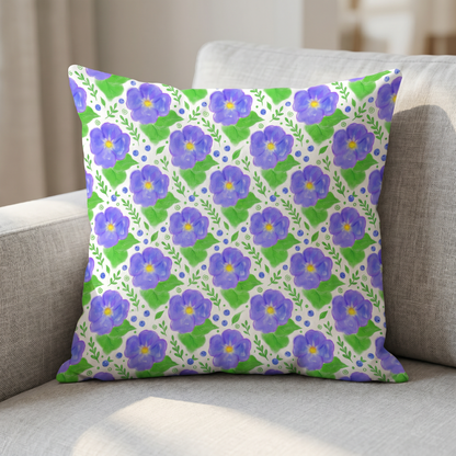 Throw pillow featuring a purple and green watercolor floral pattern.
