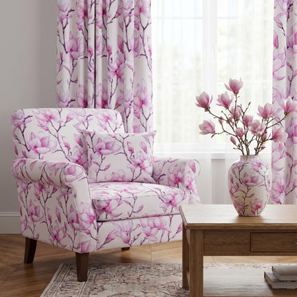 Mockup of a cozy living room featuring an armchair and curtains printed with an elegant pink magnolia watercolor floral pattern.