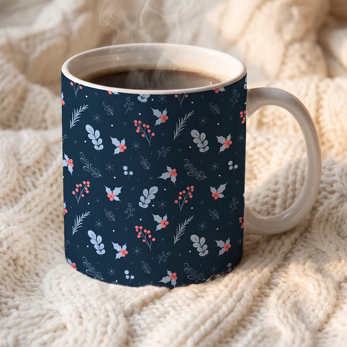 White coffee mug featuring a festive navy blue winter floral pattern with red berries.