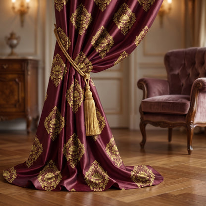 Heavy deep red and gold curtains featuring a classic vintage damask pattern.