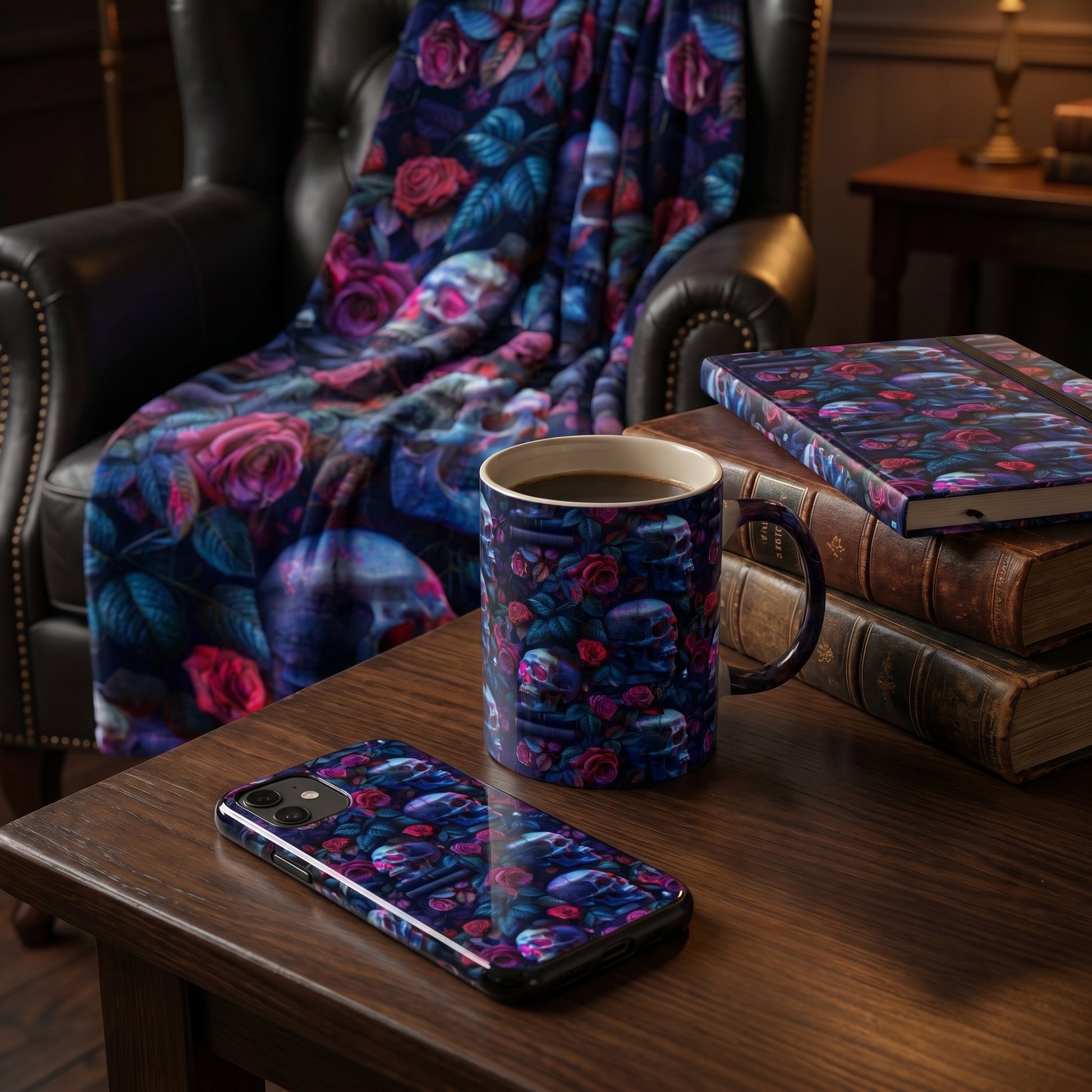 Dark academia lifestyle mockup featuring a mug, phone case, and notebook decorated with a spooky gothic skull and floral pattern.