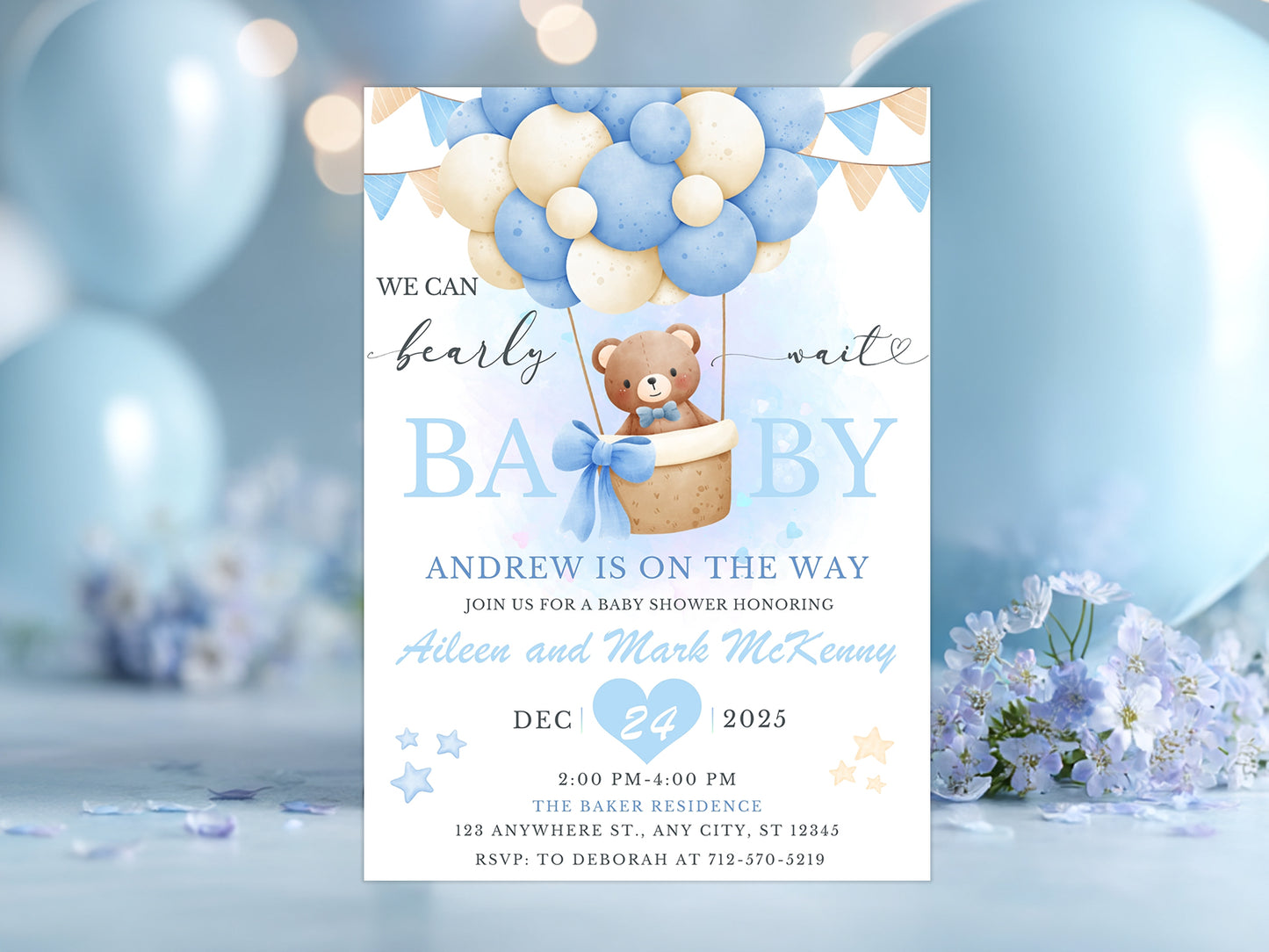 Blue and beige watercolor invitation featuring a teddy bear in a hot air balloon with the text "We Can Bearly Wait".
