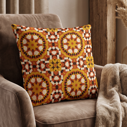 Terracotta and gold mosaic pattern on a decorative cushion