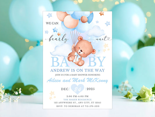 Blue and white baby shower invitation featuring a brown teddy bear floating with a bunch of blue and beige balloons.