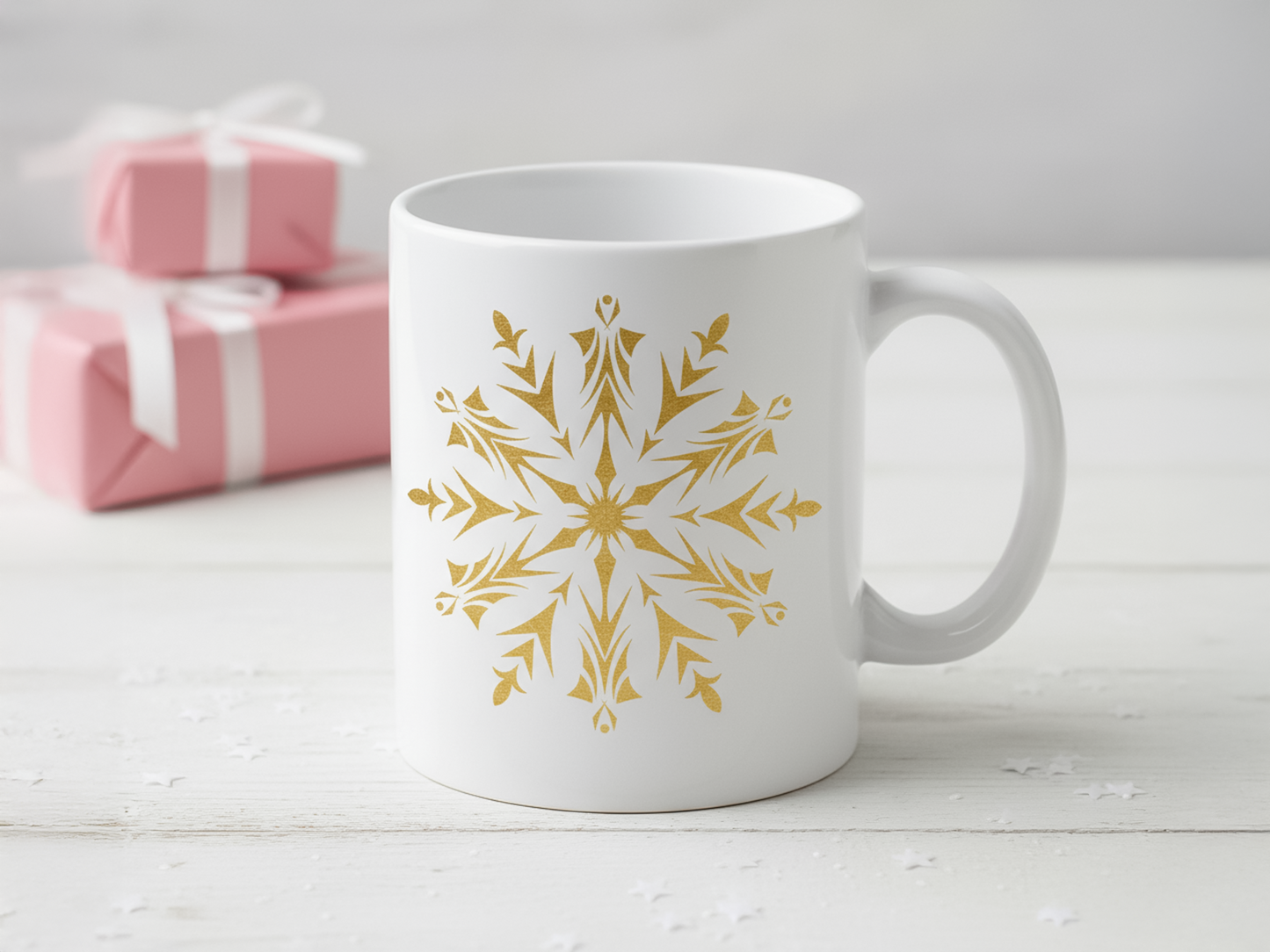 White ceramic mug with a festive gold snowflake print for Christmas