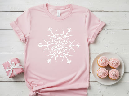 Pink t-shirt featuring a large white snowflake mandala design.